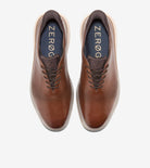 Pair of brown shoes with 'ZEROG' branding on a white background