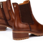 Brown leather boots with a block heel on a white background