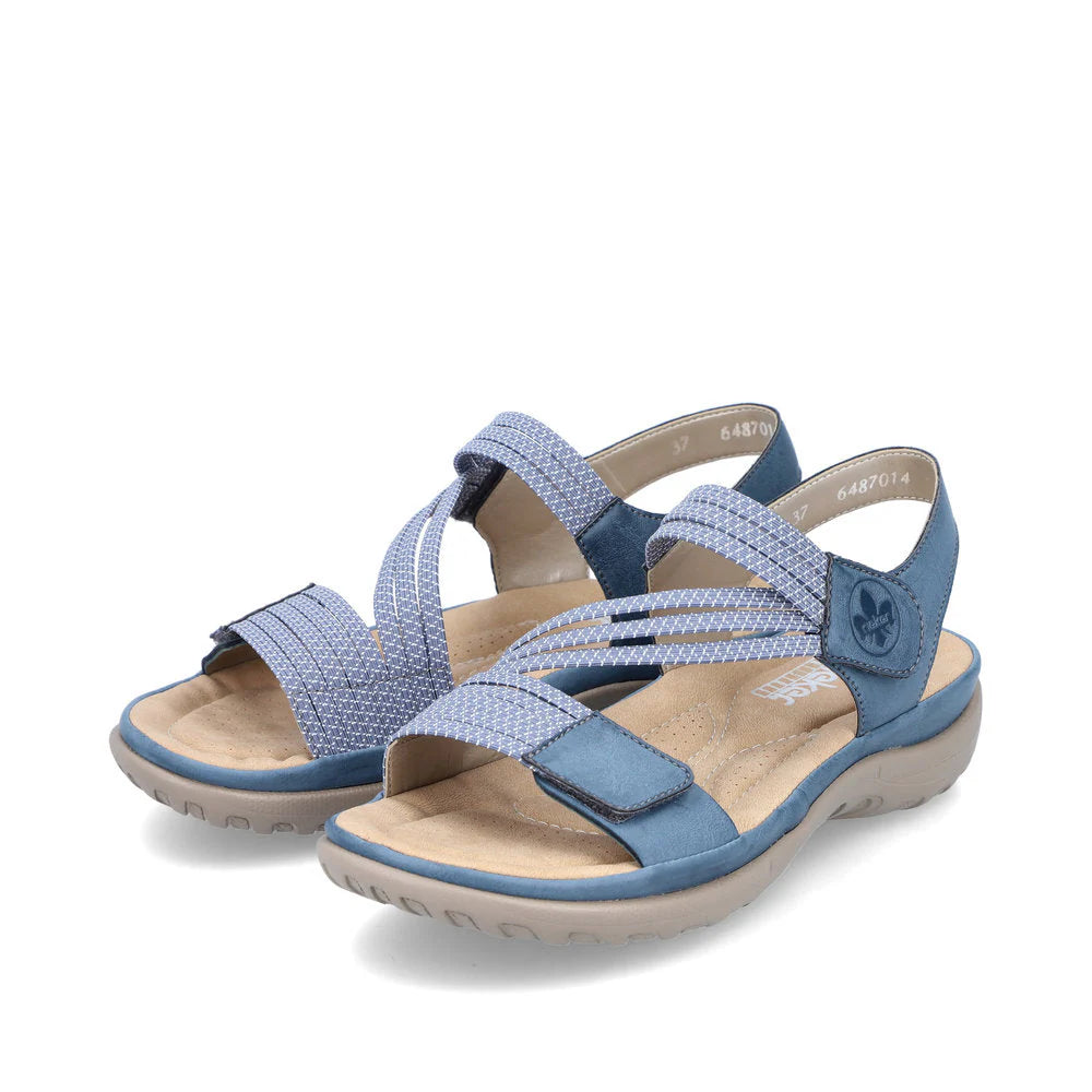 Pair of blue sandals with a white background