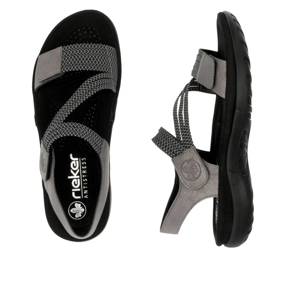 Black and gray sandals with a visible brand logo on a white background