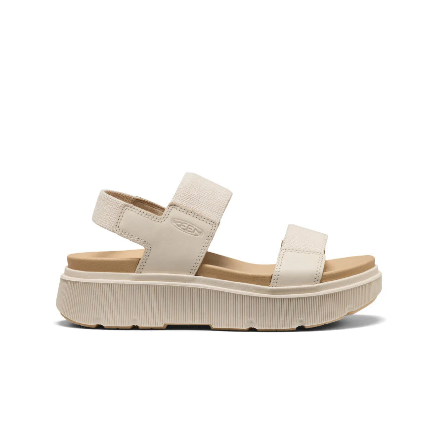Beige sandal with platform sole on a white background