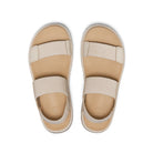 Pair of beige sandals with strap details on a white background