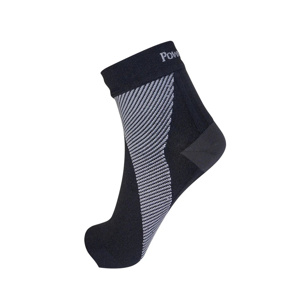 Black sock with a patterned design on a white background