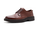 A brown leather lace-up dress shoe with a chunky black sole, shown from a side profile on a white background.