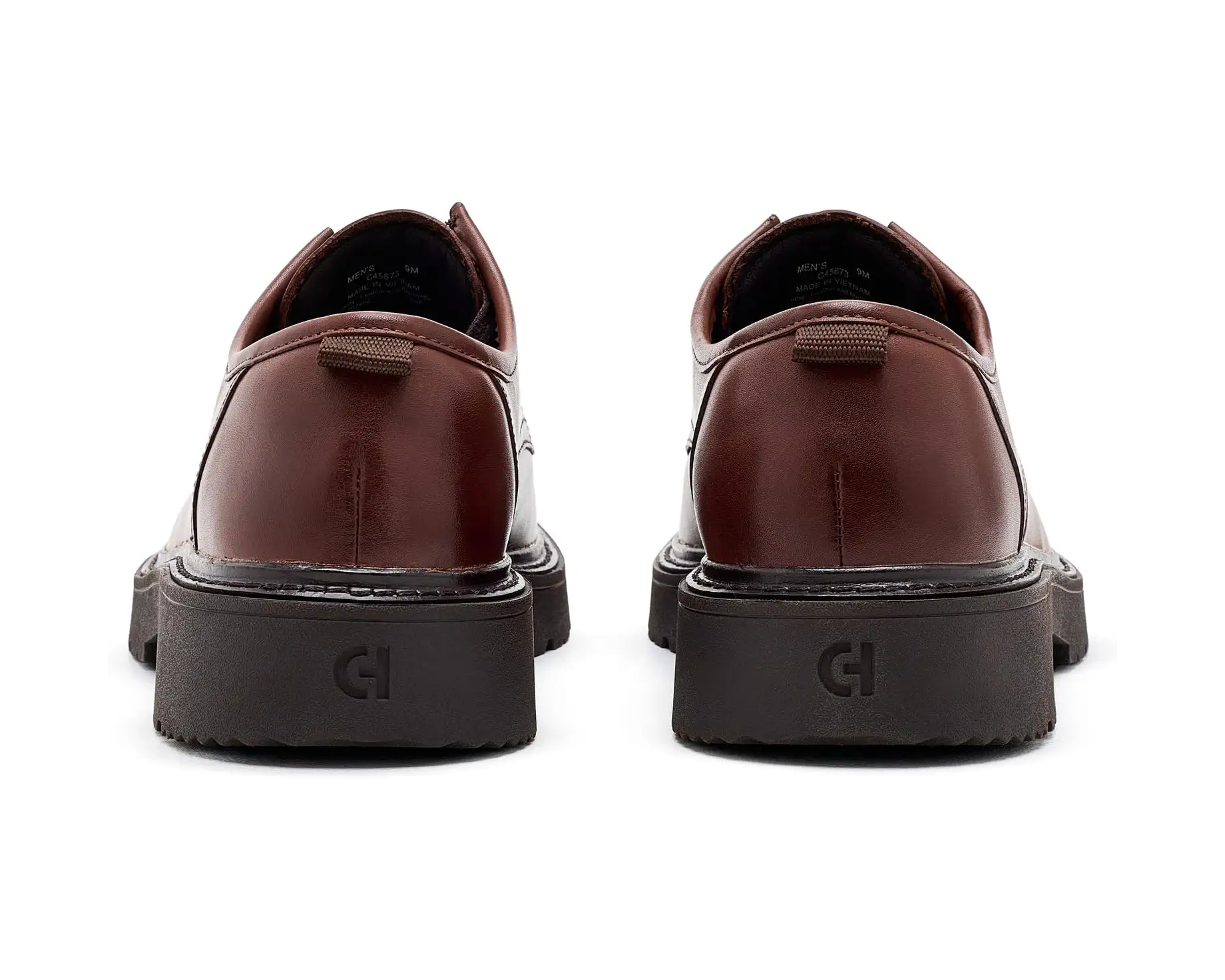 A pair of dark brown leather oxford shoes shown from the back, featuring chunky black platform soles with an embossed 'CI' logo, set against a plain white background.