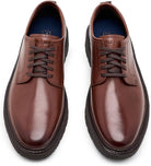 A pair of men's brown leather lace-up shoes with dark brown laces and thick black soles, shown from a top-down perspective on a white background.