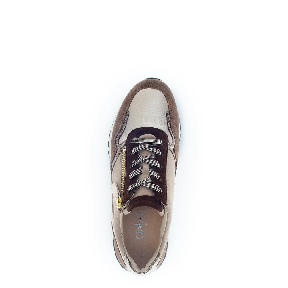 White and brown sneaker with visible brand logo on a white background
