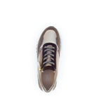 White and brown sneaker with visible brand logo on a white background