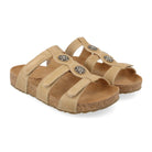Pair of beige sandals with cork sole on a white background