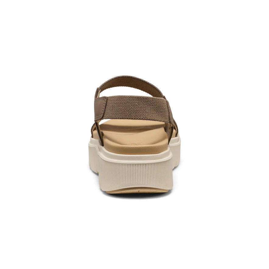 Beige sandal with a platform sole on a white background