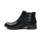 Black ankle boot with plaid patch on a white background