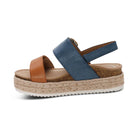 Blue and brown sandal with cork wedge sole on a white background