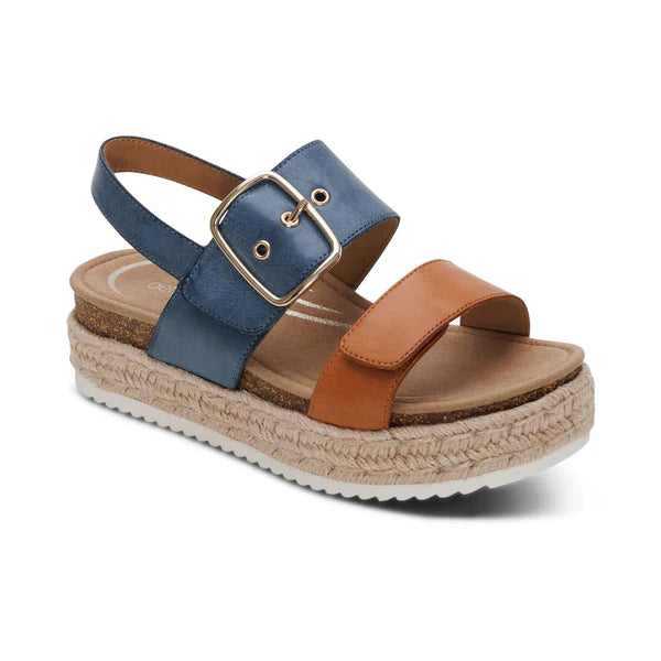 Blue and brown sandal with cork sole on a white background