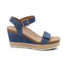Blue wedge sandal with espadrille sole on a white background