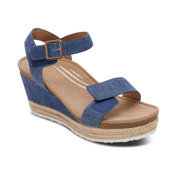 Blue wedge sandal with cork sole on a white background