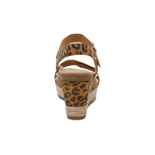 Brown wedge sandal with leopard print strap on a white background