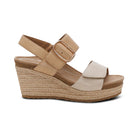 Beige wedge sandal with espadrille sole on a white background