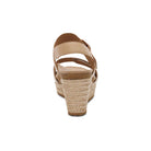 Beige sandal with a textured sole on a white background
