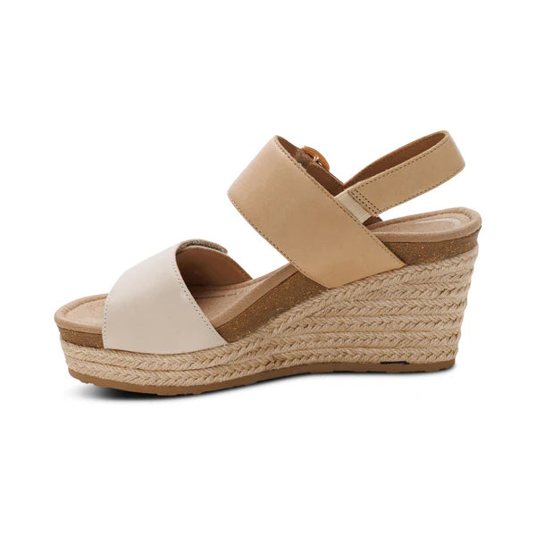 Beige wedge sandal with espadrille sole on a white background