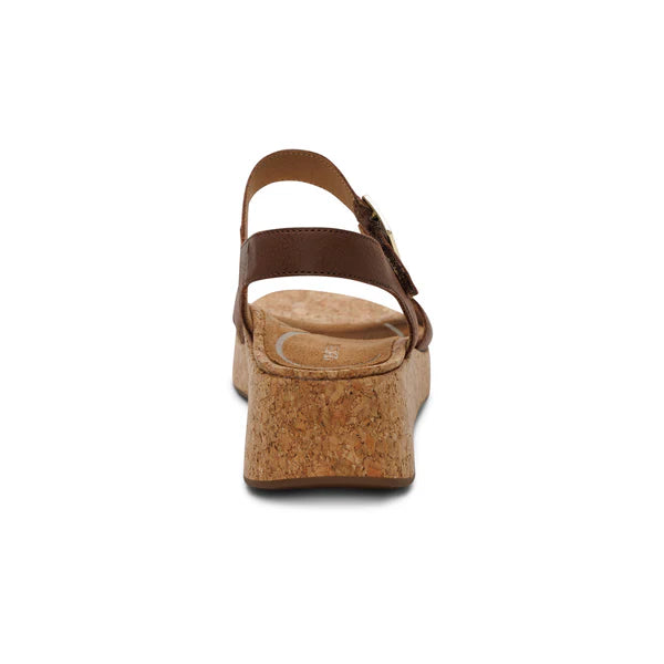 Brown cork wedge sandal on a white background
