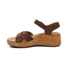 Brown wedge sandal on a white background
