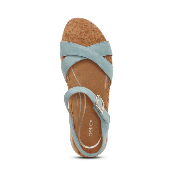 Light blue sandal with cork sole on a white background