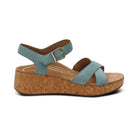 Wedge sandal with cork sole and blue straps on a white background