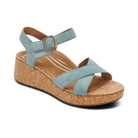Light blue wedge sandal with cork sole on a white background