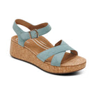 Wedge sandal with light blue straps and cork sole on a white background