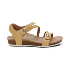 Beige sandal with brown accents on a white background