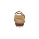 Tan sandal with cork sole on a white background