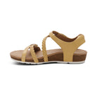 Beige sandal with braided straps on a white background