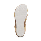 Close-up of a sandal's sole with brand logo on a white background