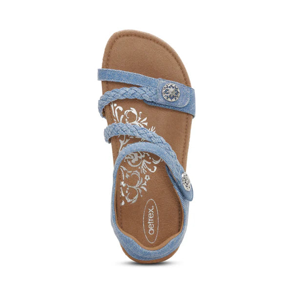 Blue sandal with braided strap on a white background