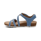 Blue sandal with a brown sole on a white background