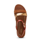 Brown sandal with gold and red accents on a white background
