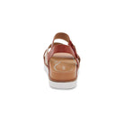 Brown sandal with a white sole on a white background