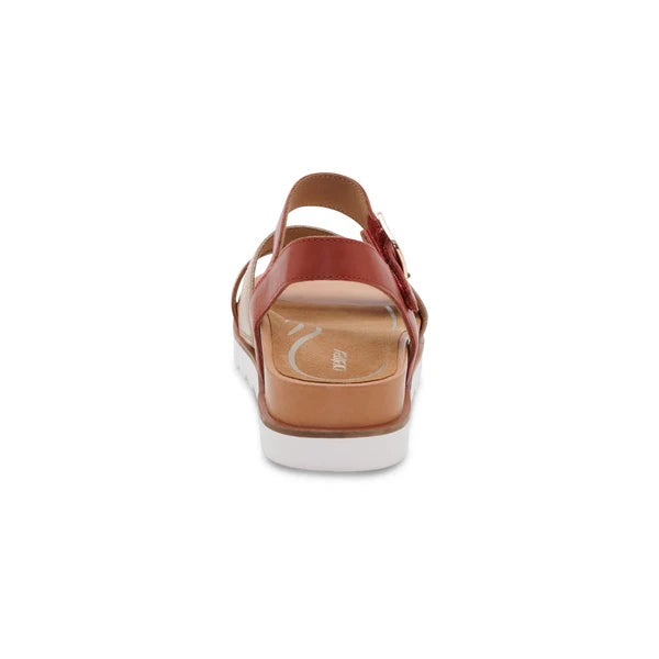 Brown sandal with a white sole on a white background