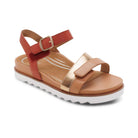 Tan sandal with red strap and gold accents on a white background