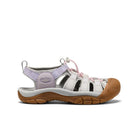 White sandal with brown sole and purple accents on a white background