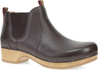 A black leather Chelsea boot with a natural wood-look stacked heel and contrast stitching, shown from a three-quarters angle on a white background.