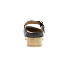 Black sandal with a wooden sole on a white background