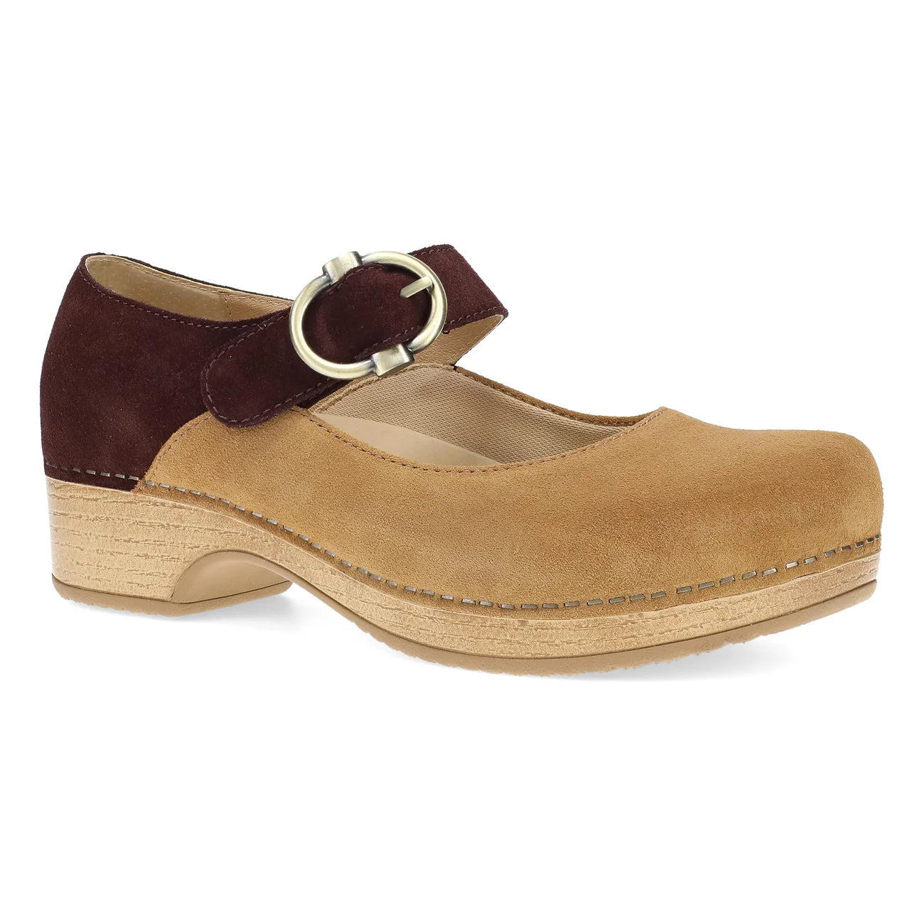Tan clog shoe with brown strap and buckle on a white background
