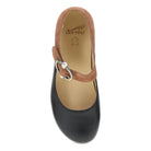Black shoe with brown strap and 'Dansko' logo on a white background