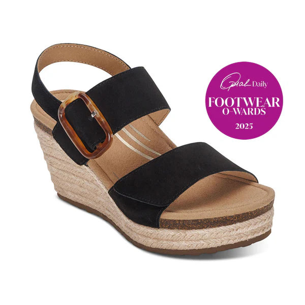 Black wedge sandal with cork sole on a white background, featuring 'Daily Mail Footwear O'Wards 2025' badge.
