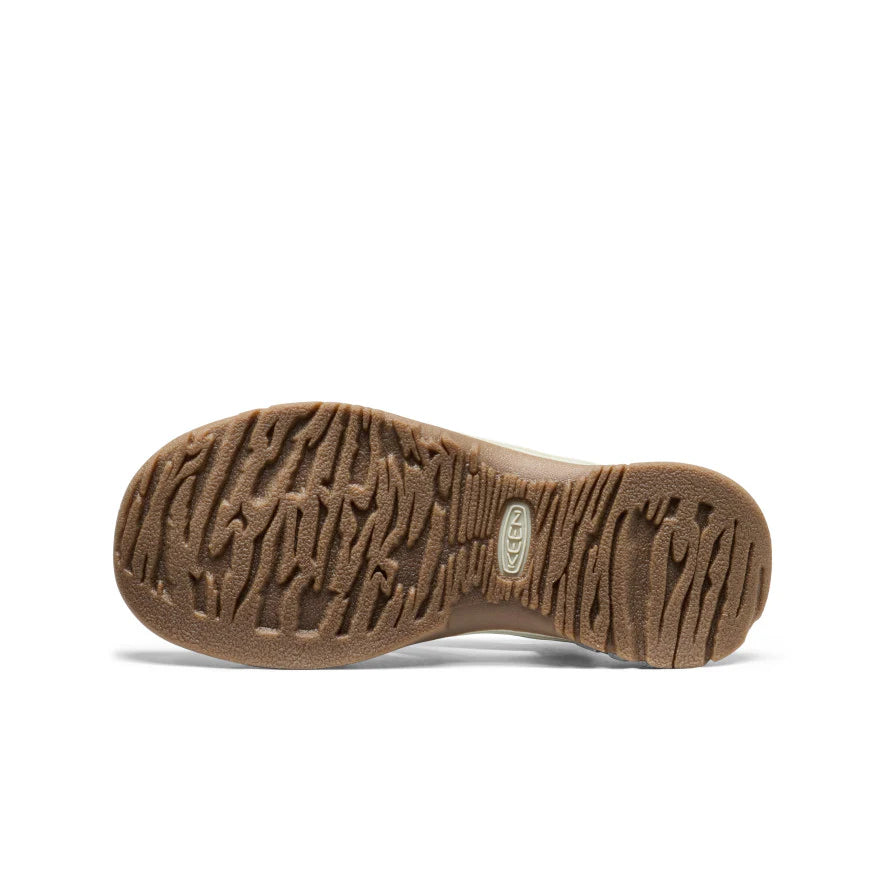 Brown sole of a shoe with brand logo on a white background