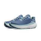 Blue running shoe with white sole on a transparent background