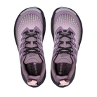 A pair of women's trail running shoes in a dusty lavender-purple colorway, shown from a top-down view on a solid white background. The shoes feature a breathable mesh upper, black and white speckled laces, a black and white outsole, and a pink pull tab at the heel.