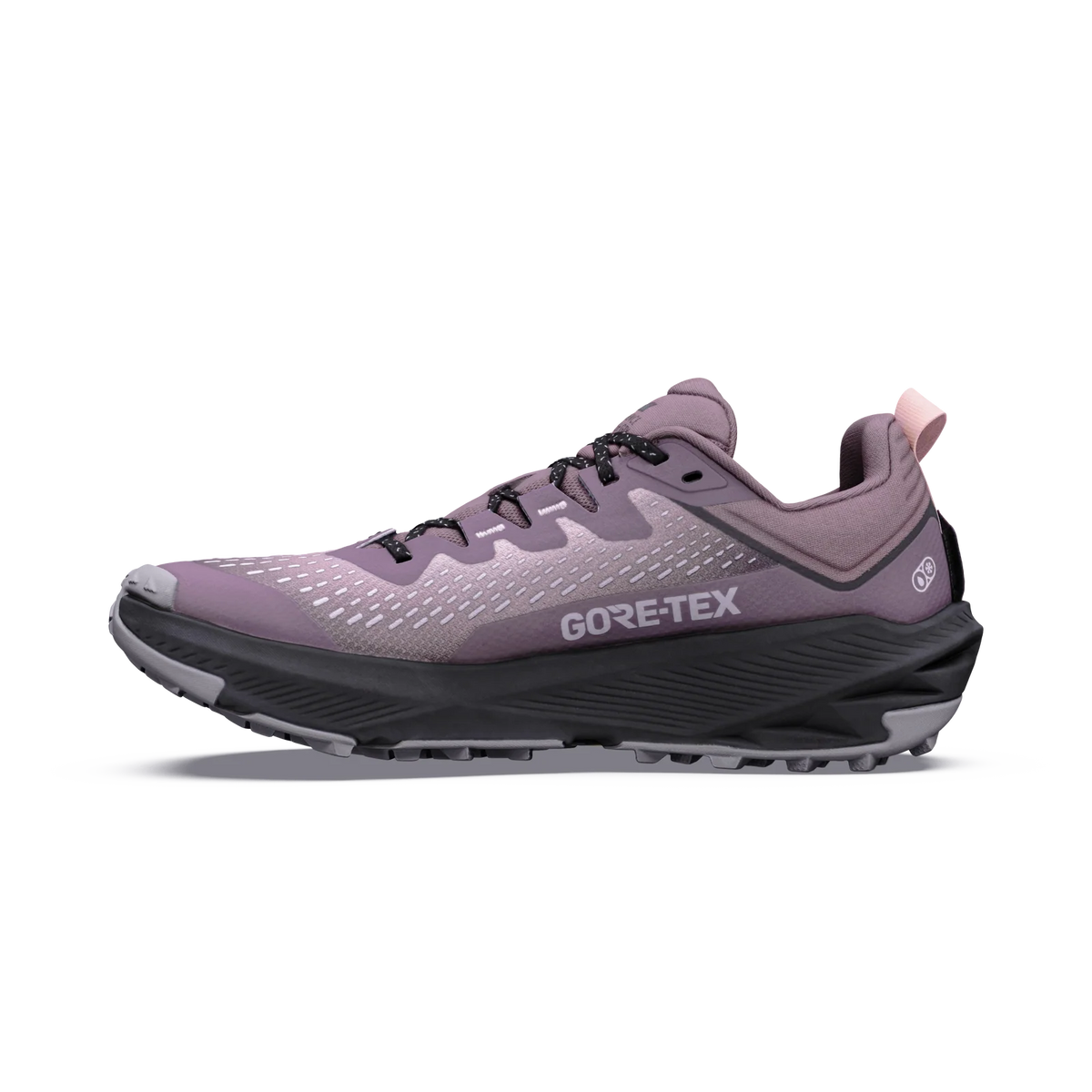 A single GORE-TEX trail running shoe in a dusty lavender-purple colorway, featuring a black midsole and black laces, shown in a side profile on a white background.