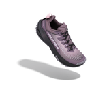A single trail running shoe floating at an angle against a solid white background, featuring a purple and black colorway with a small pink pull tab.